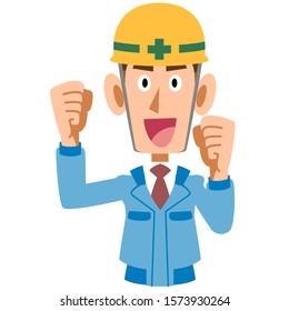 A man on the construction site in blue work clothes