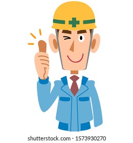 A man on the construction site in blue work clothes thumbs up