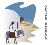 Man on a donkey on the narrow street of the ancient eastern  city