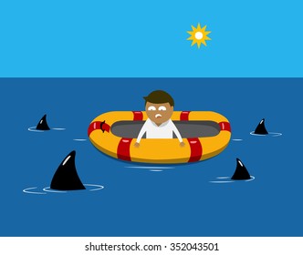 Man on a lifeboat in the sea, with sharks  around his boat