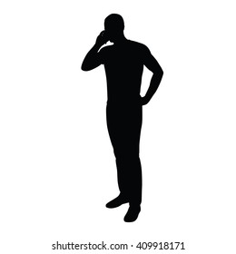 Man on the phone while standing. Vector silhouette of a man with a mobile phone