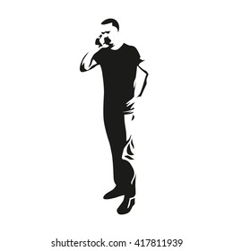 Man on the phone while standing illustration. Vector silhouette of a man with a mobile phone