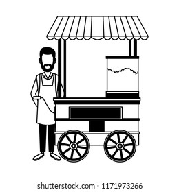 Man on popcorn booth in black and white