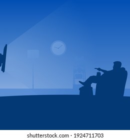 man on sofa holding remote control in front of flat television at his living room