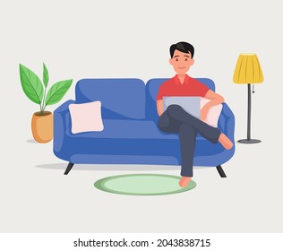 Man on the sofa with laptop. Businessman work at home. Freelancer. Learn online on a computer sitting on sofa . Father leisure on the couch