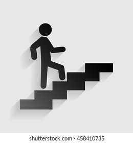 Man on Stairs going up. Black paper with shadow on gray background.