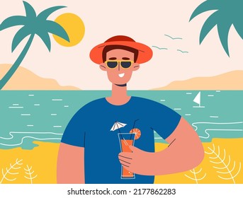 Man on summer vacation concept. Happy boy  holds cocktail in her hand. He is wearing sunglasses. Concept for outdoor activities and summer travel topics.
