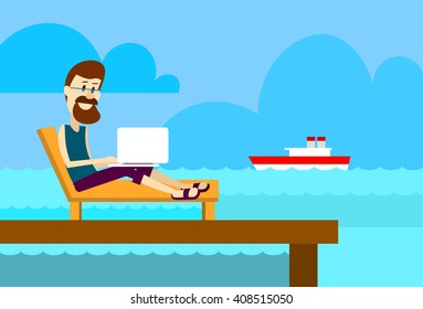 Man On Sunbed Using Laptop