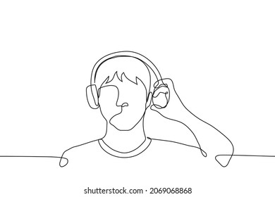 man in On-Ear headphones left earphone from being pulled from the ear - one line drawing vector. concept man in headphones interrupted listening to music to hear the sound outside 