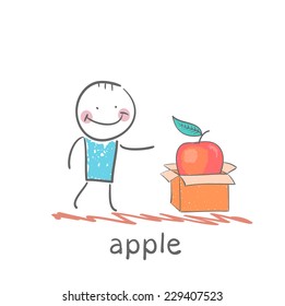 man opens a box with an apple
