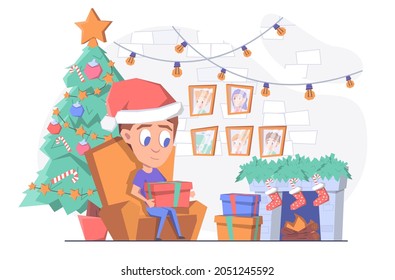 А man opens Christmas presents by the fireplace and the Christmas tree