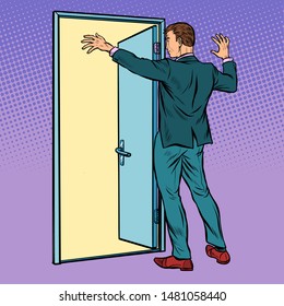 A man opens the door, greeting. Pop art retro vector illustration drawing