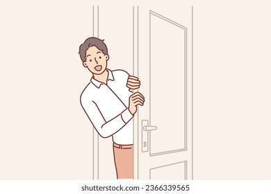 Man opens door and peeks into boss office, asking permission to enter and discuss work matters. Young guy office clerk escorts guests or sees if there are clients waiting for reception