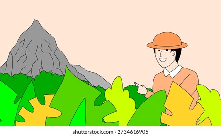 Man in an orange hat is standing in a forest with a mountain in the background. He is pointing to something in the distance