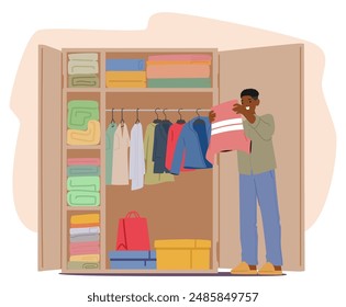 Man Organizing Clothes In A Neatly Arranged Wardrobe At Home, Carefully Inspecting A Shirt, Representing Tidiness And Organization. Wardrobe Contains Folded Clothes, Hanging Garments And Storage Boxes