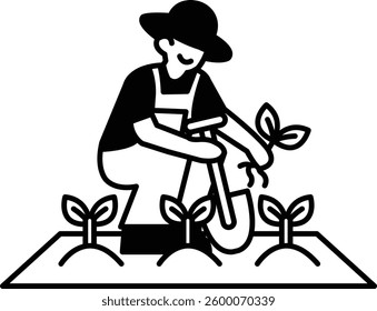 A man in a overalls is digging a hole in the dirt