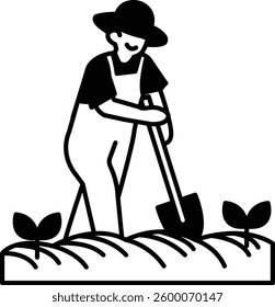 A man in a overalls is digging a hole in the ground