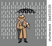 Man in overcoat holding umbrella