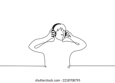 man with over-ear headphones - one line drawing vector. concept listen to music, audio book or podcast through over-ear headphones