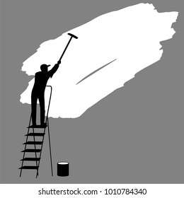 man paints the wall