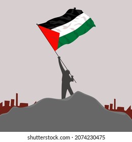 man with palestina flag on top of hill