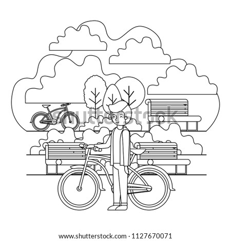 man in the park with bicycle