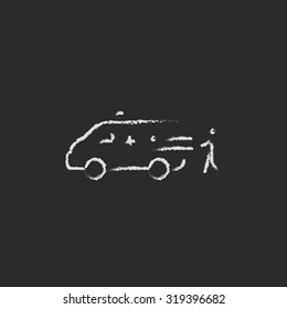 Man with patient and ambulance car hand drawn in chalk on a blackboard vector white icon isolated on a black background.