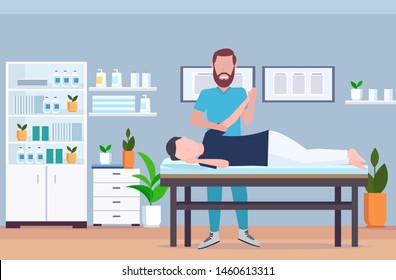 man patient lying on massage table therapist doing healing treatment massaging injured hand manual physical therapy rehabilitation concept full length modern hospital office interior horizontal