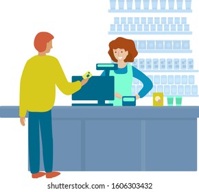 Man is paying the cash desk of supermarket. Man pays for purchases