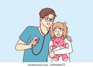 Man pediatrician hugs little girl with toy before examination and holds stethoscope to detect diseases. Kind pediatrician taking care of young female patient undergoing treatment in hospital