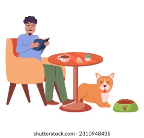 Man in pet-friendly cafe with dog. Pet friendly restaurant.Dog eating from bowl. Guy sitting drinking coffee and works in a laptop remotely .Remote work.A guy is reading a book in a cafe