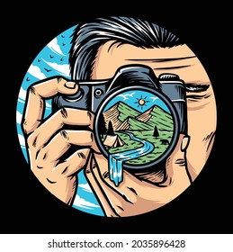 Man photographer with camera taking photo of mountains