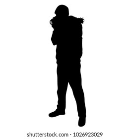 A man photographing with a camera, silhouette on a white background