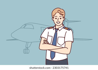 Man pilot of airplane stands with arms crossed near airliner inviting to buy new airline ticket. Confident guy airliner captain or aircraft pilot posing before departure from airport