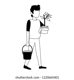 Man with plant and water can in black and white