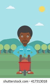 Man with plant and wheelbarrow.
