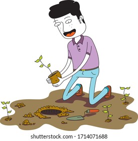 man plants a small plant on the ground