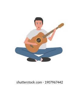 man playing acoustic guitar and singing