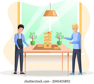 Man playing block tower home together. People with board game indoor. Male character is playing with logic game on weekend. Guy collects wooden tower from bricks. Wooden blocks stacked in high tower
