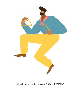 man playing triangle junina celebration