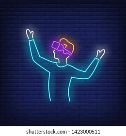 Man playing VR game neon sign. Technology, innovation, gaming design. Night bright neon sign, colorful billboard, light banner. Vector illustration in neon style.