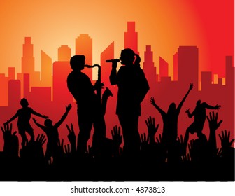 A man plays the sax while a woman sings and the crowd goes wild with a city as backdrop