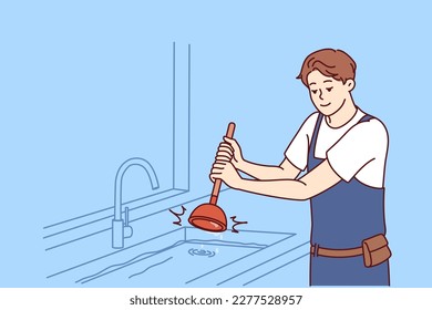 Man plumber uses plunger to clear blockage in sink in kitchen or bathroom. Guy working as plumber is dressed in overalls and is engaged in elimination breakdown associated with debris stuck in pipe 