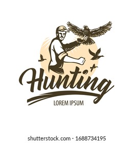 Man practicing hunting with falcons. Hawk with spread wings sits on the hunter's hand. Predator species with broad wings, sharp beaks and claws.  