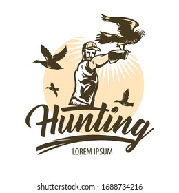 Man practicing hunting with falcons. Hawk with spread wings sits on the hunter's hand. Predator species with broad wings, sharp beaks and claws.  
