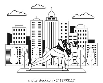 Man practicing yoga asana in open air in city park. Male doing revolved side angle pose on nature. Fitness exercises on yoga mat in city park with trees and skyscrapers. Healthy lifestyle concept.