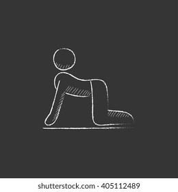 Man practicing yoga. Drawn in chalk icon.