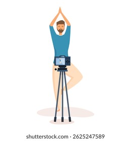 Man practicing yoga in tree pose, recording online class with camera on tripod