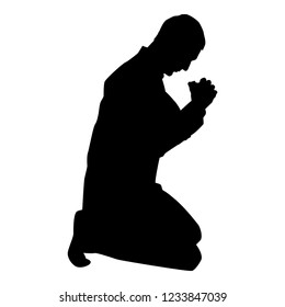 Man pray on his knees silhouette icon black color