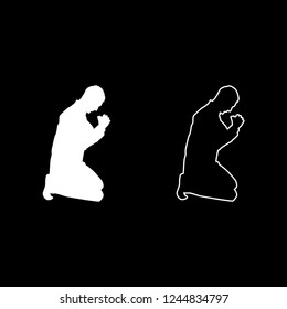 Man pray on his knees silhouette icon outline set white color